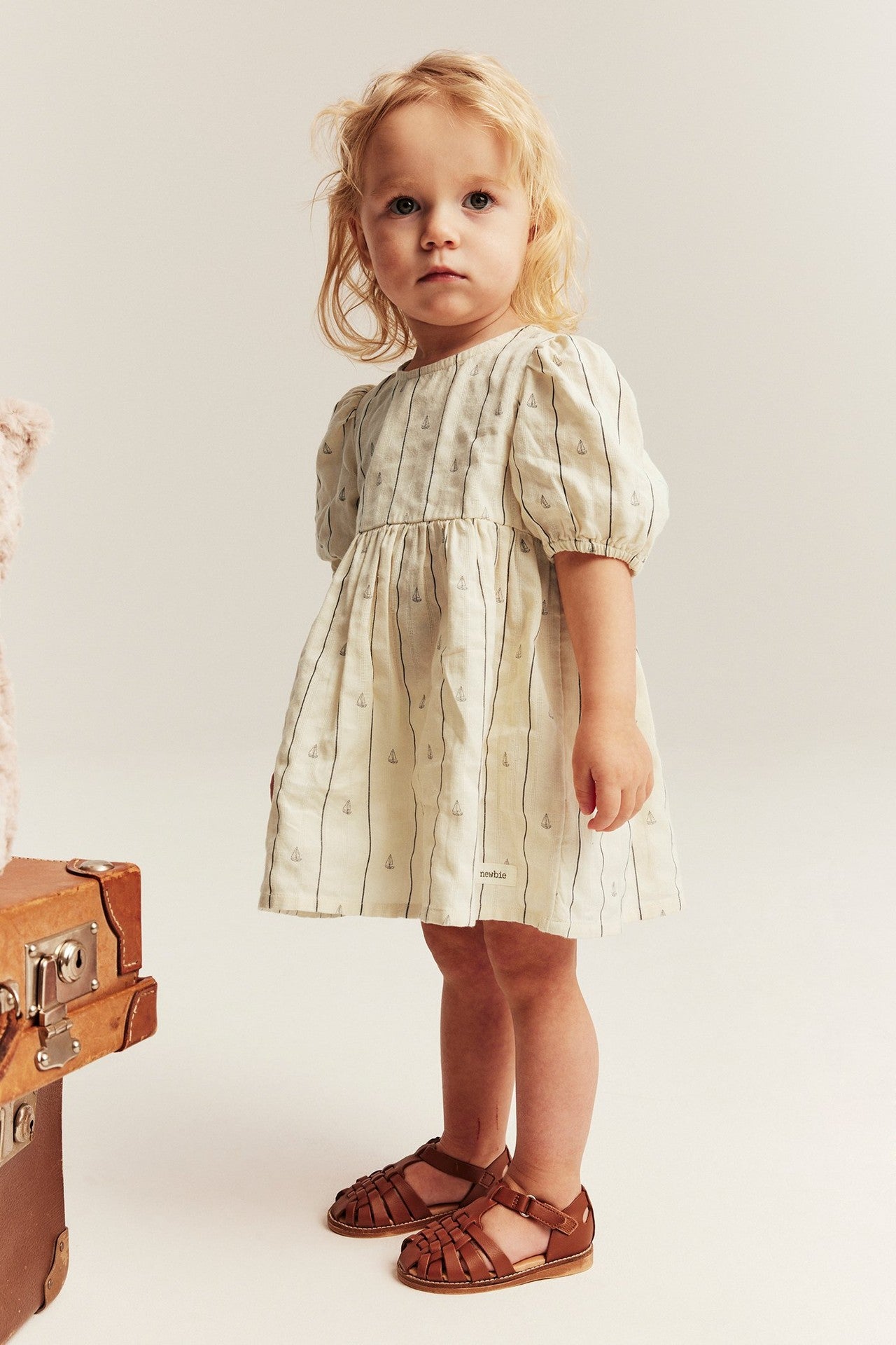 Baby cream striped dress with sailboats