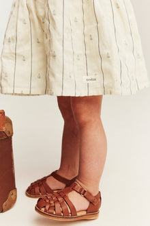 Baby cream striped dress with sailboats