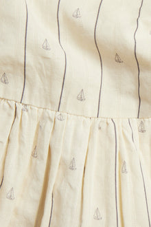 Kids cream dress with sailboats