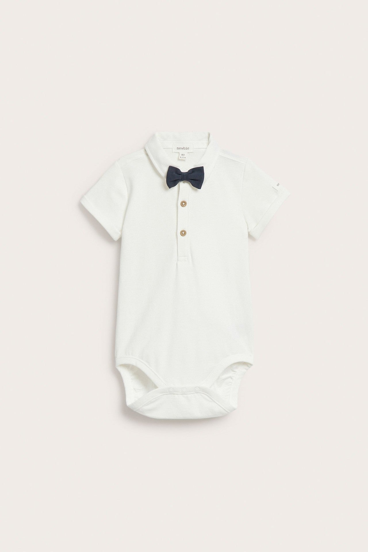 Baby white short-sleeved bodysuit with bow tie