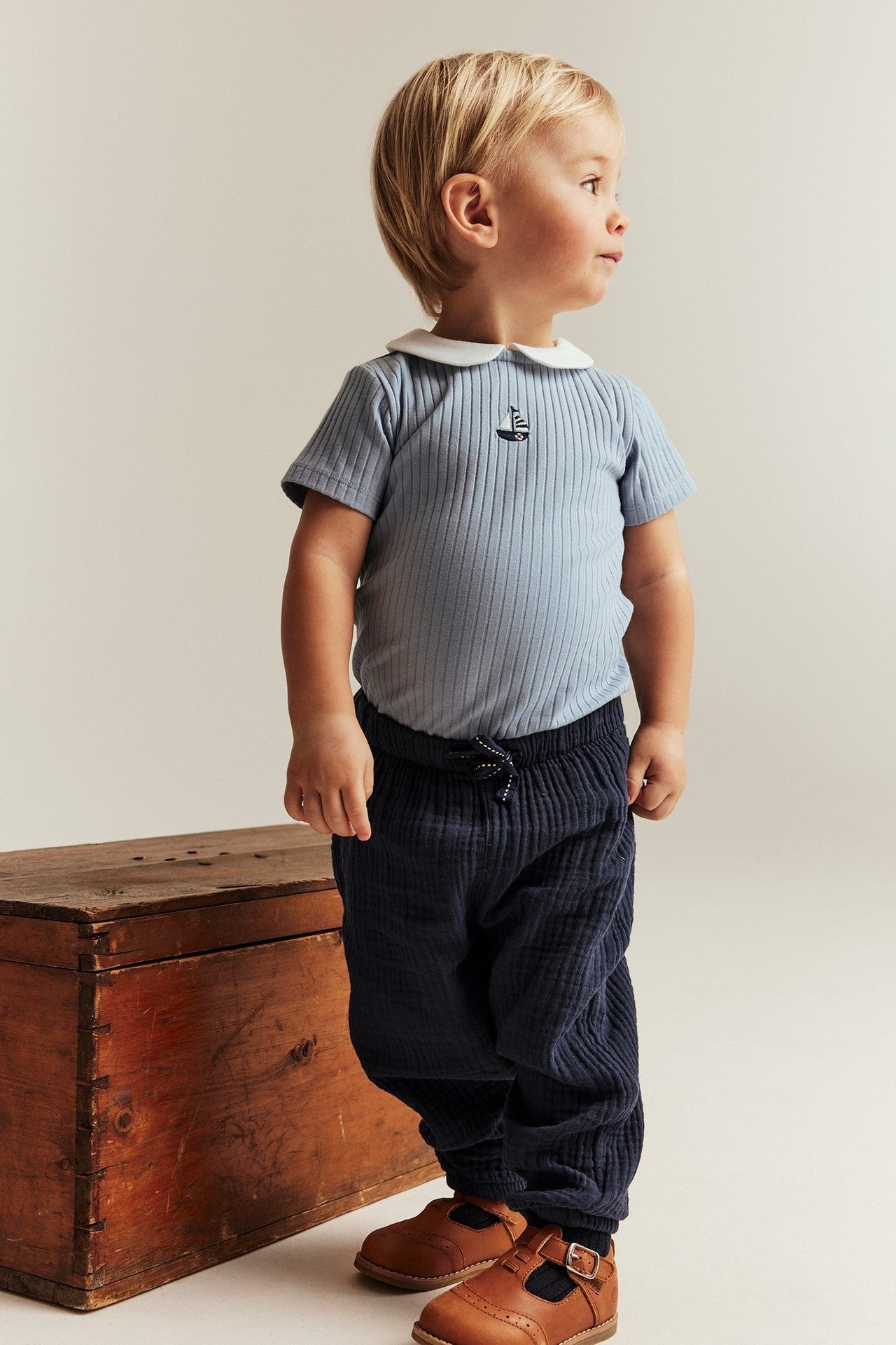 Baby blue bodysuit with sailboat