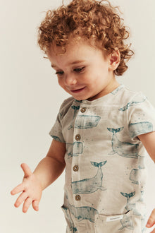 Baby whale‑print romper