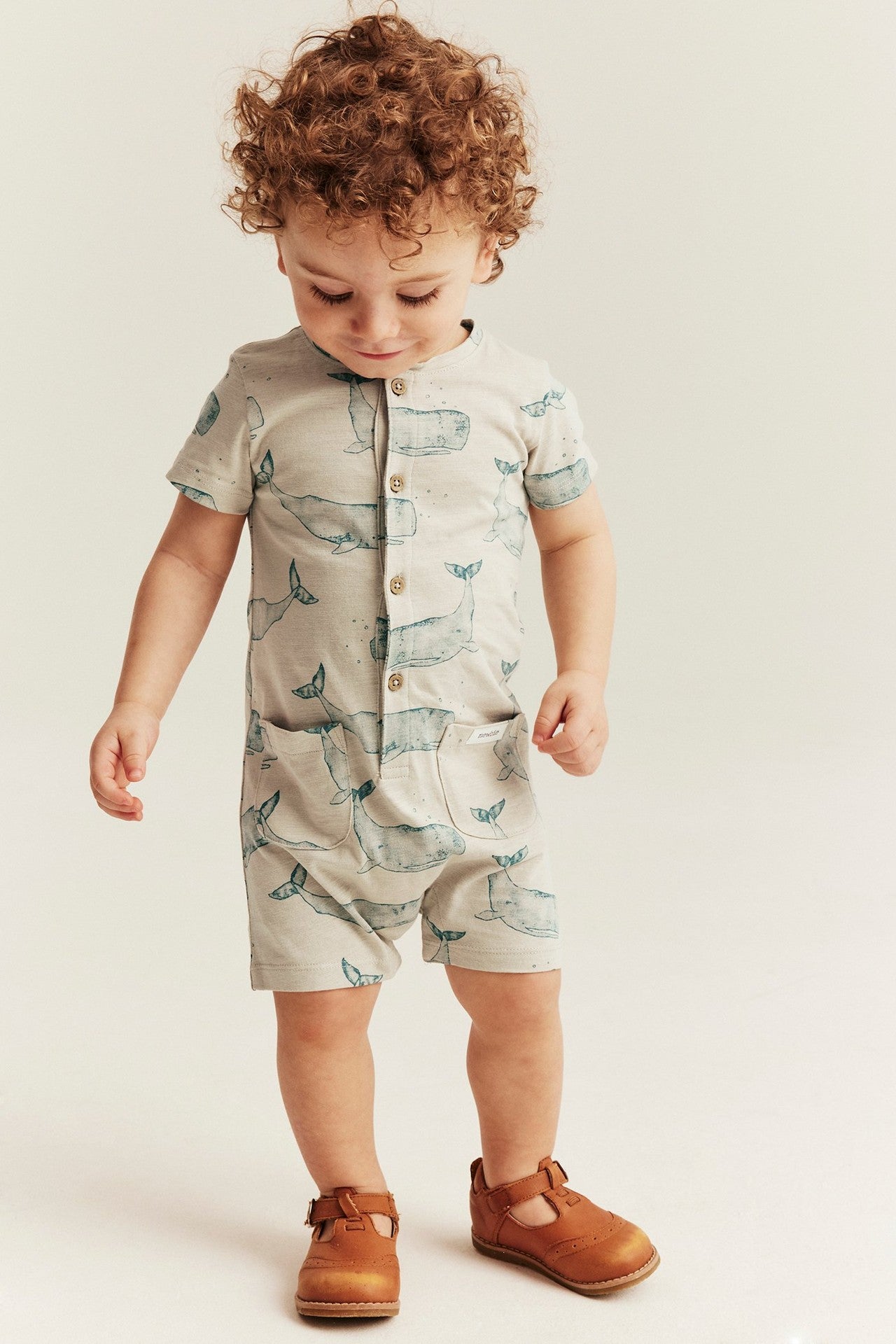 Baby whale‑print romper