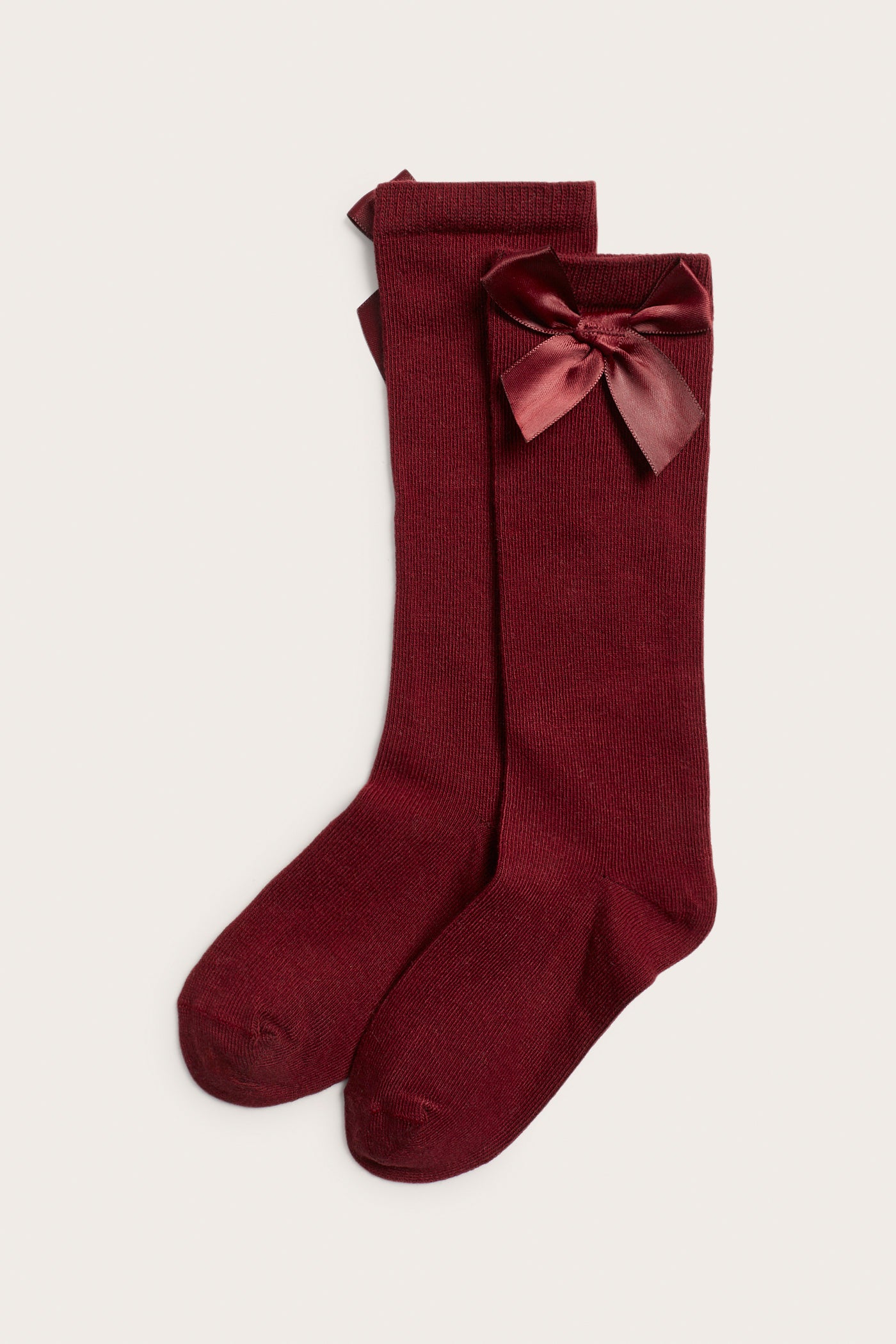 Kids´ red knee-high bow socks