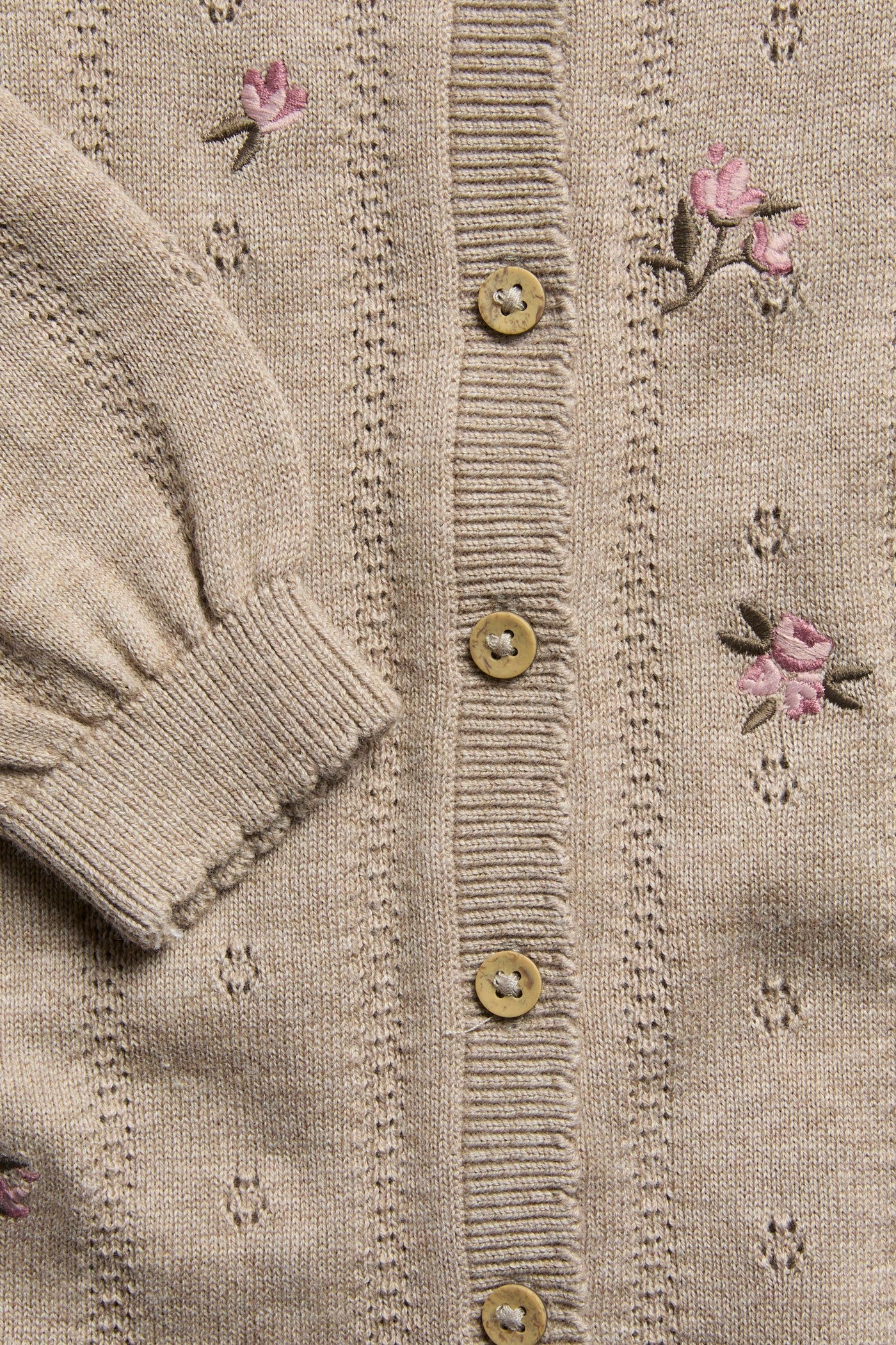 Baby beige knitted and patterned jumpsuit