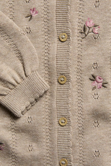 Baby beige knitted and patterned jumpsuit