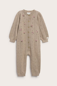 Baby beige knitted and patterned jumpsuit
