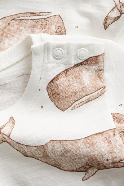 Baby white whale‑print bodysuit