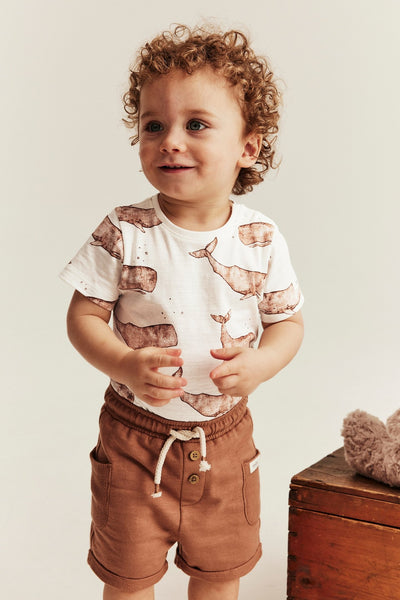 Baby white whale‑print bodysuit