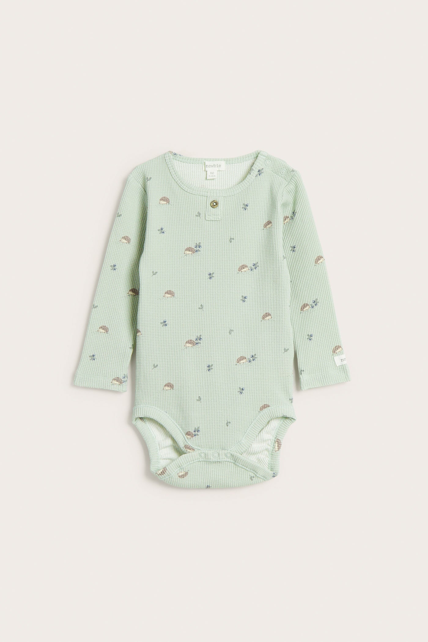 Baby green hedgehog-patterned bodysuit