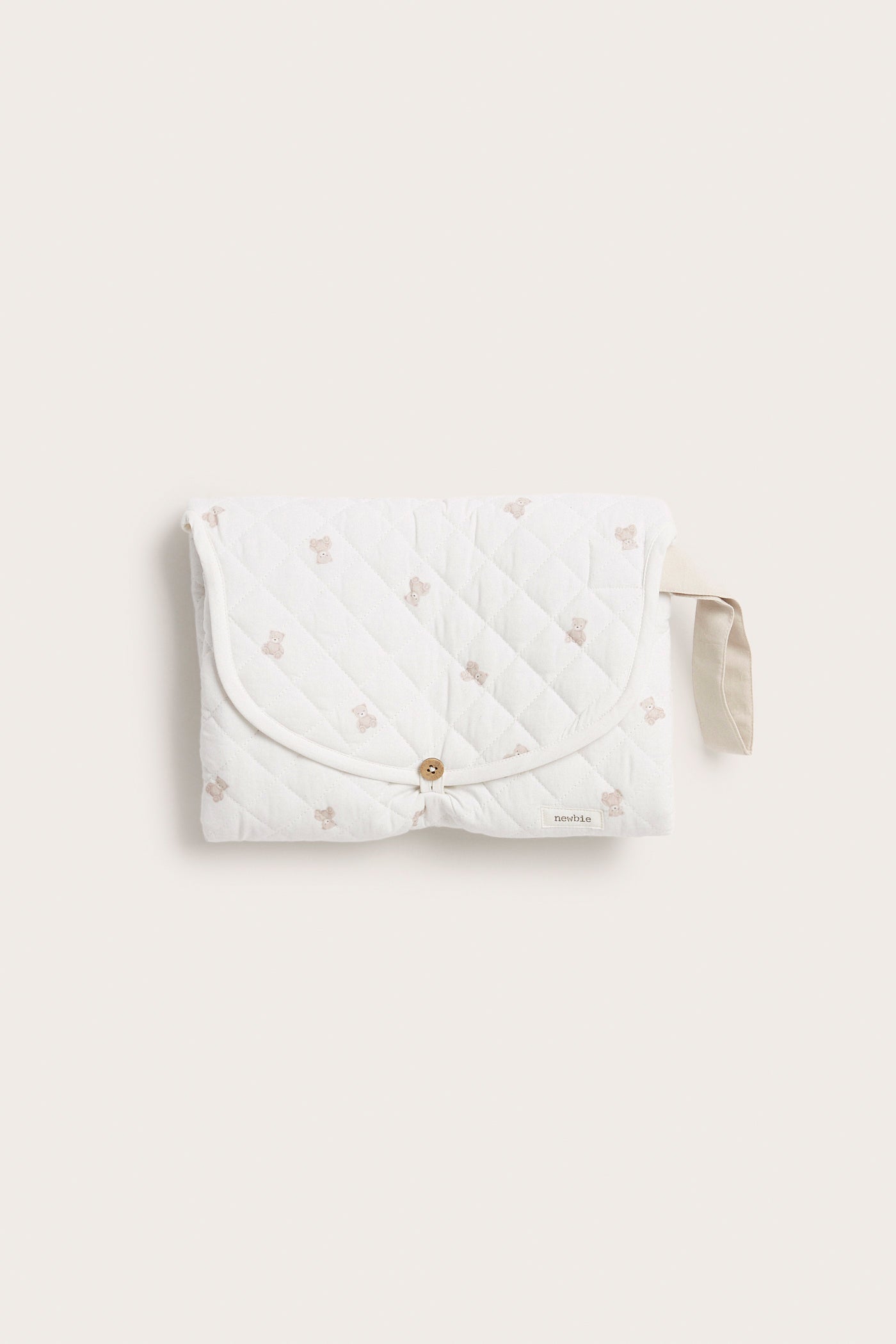 Foldable white changing mat with teddy bears