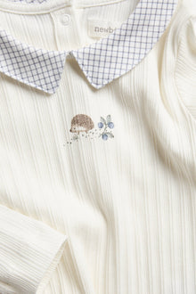Baby white bodysuit with hedgehog print