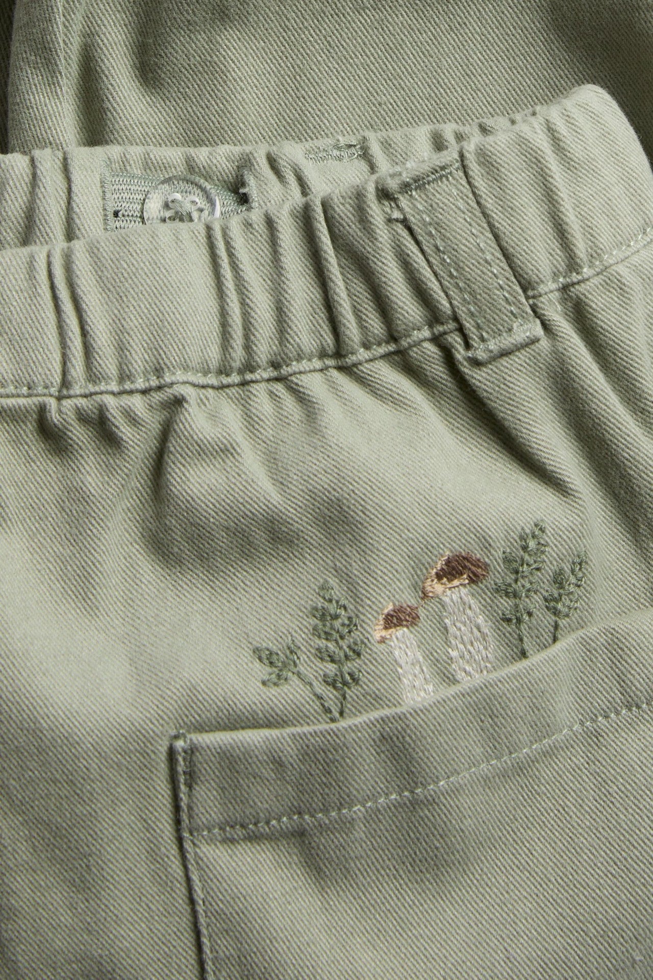 Baby green trousers with embroidery