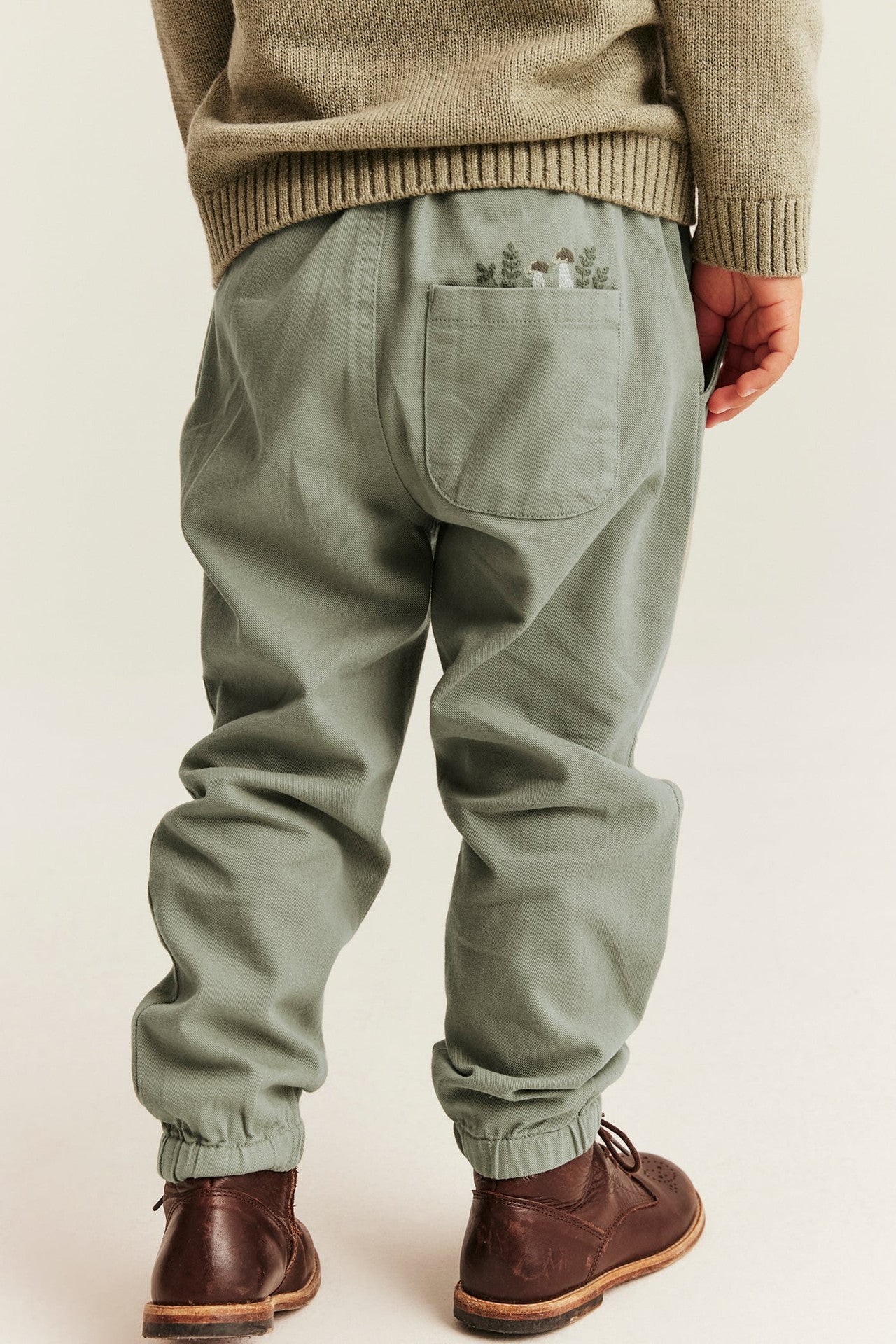 Kids green trousers with embroidery