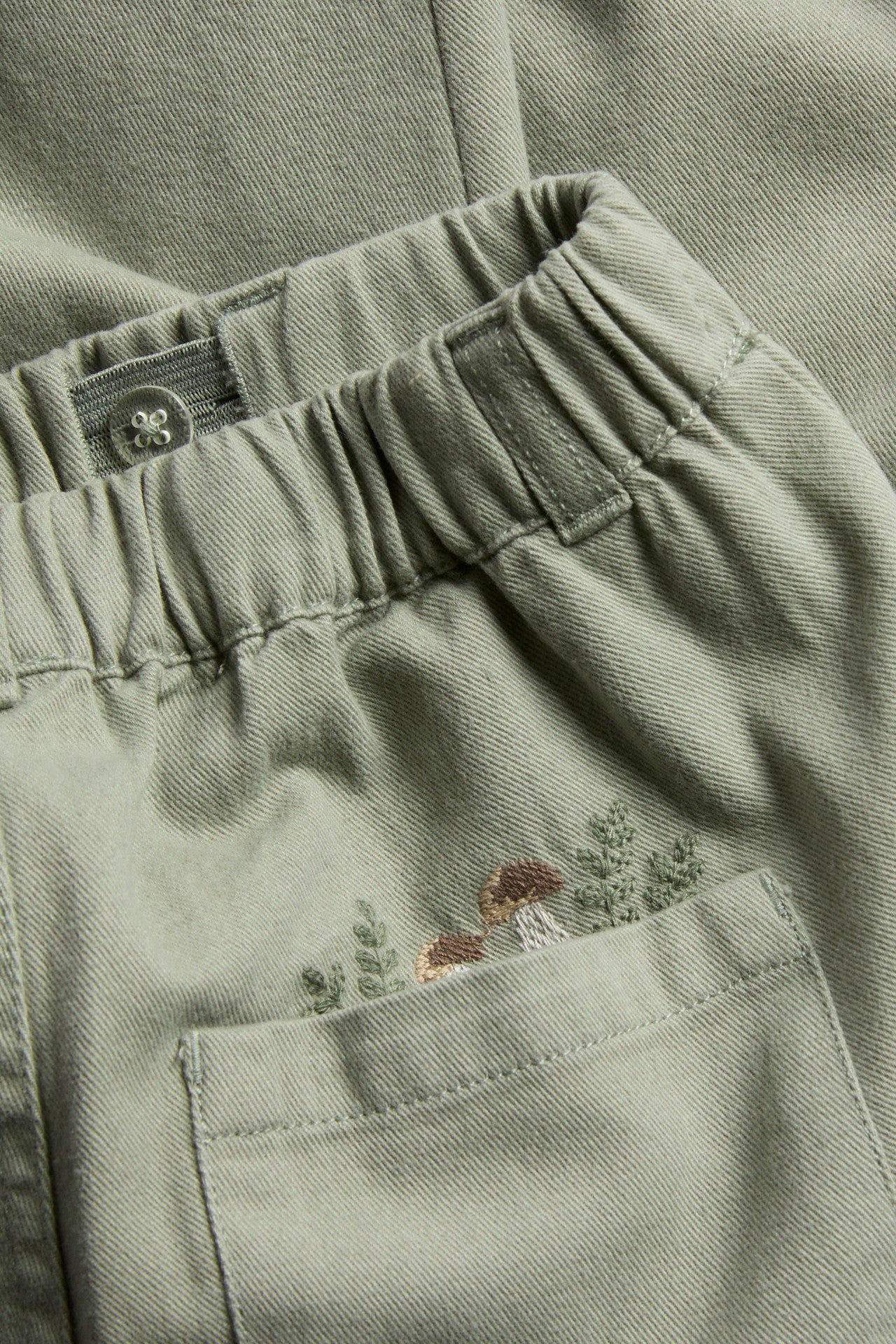 Kids green trousers with embroidery