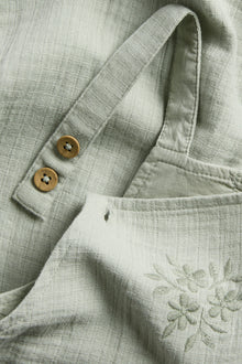 Baby dungarees with lace frill