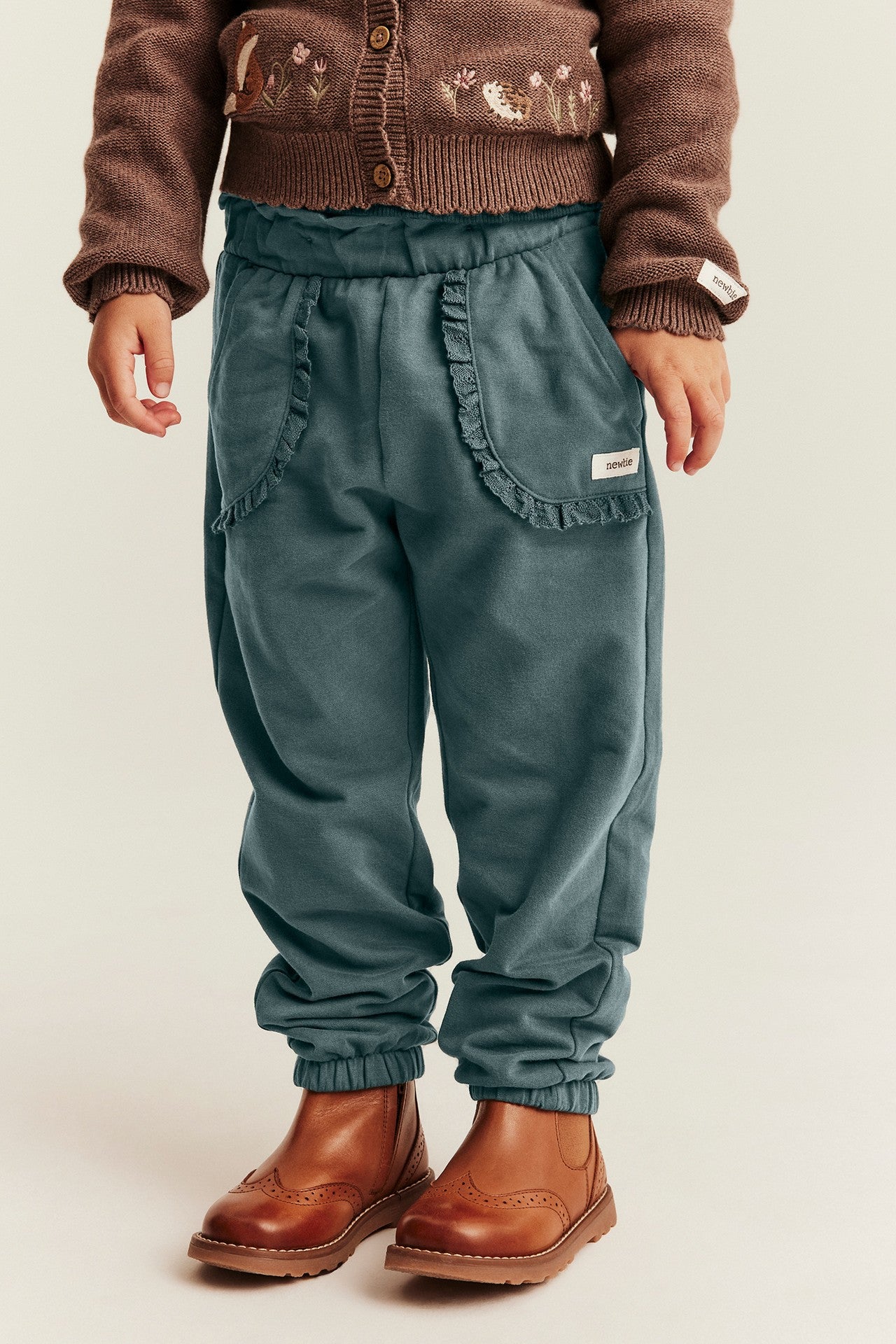 Kids green joggers with lace details