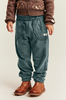 Kids green joggers with lace details