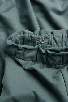 Kids green joggers with lace details