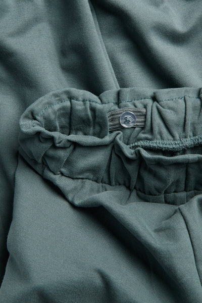 Kids green joggers with lace details