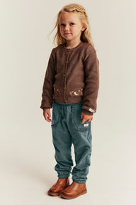 Kids green joggers with lace details