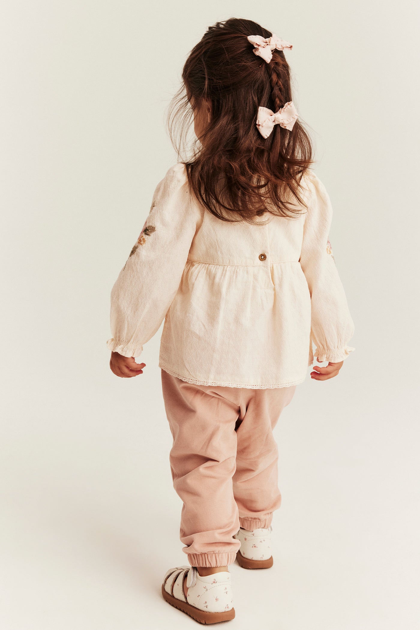 Baby bodysuit with floral embroidery