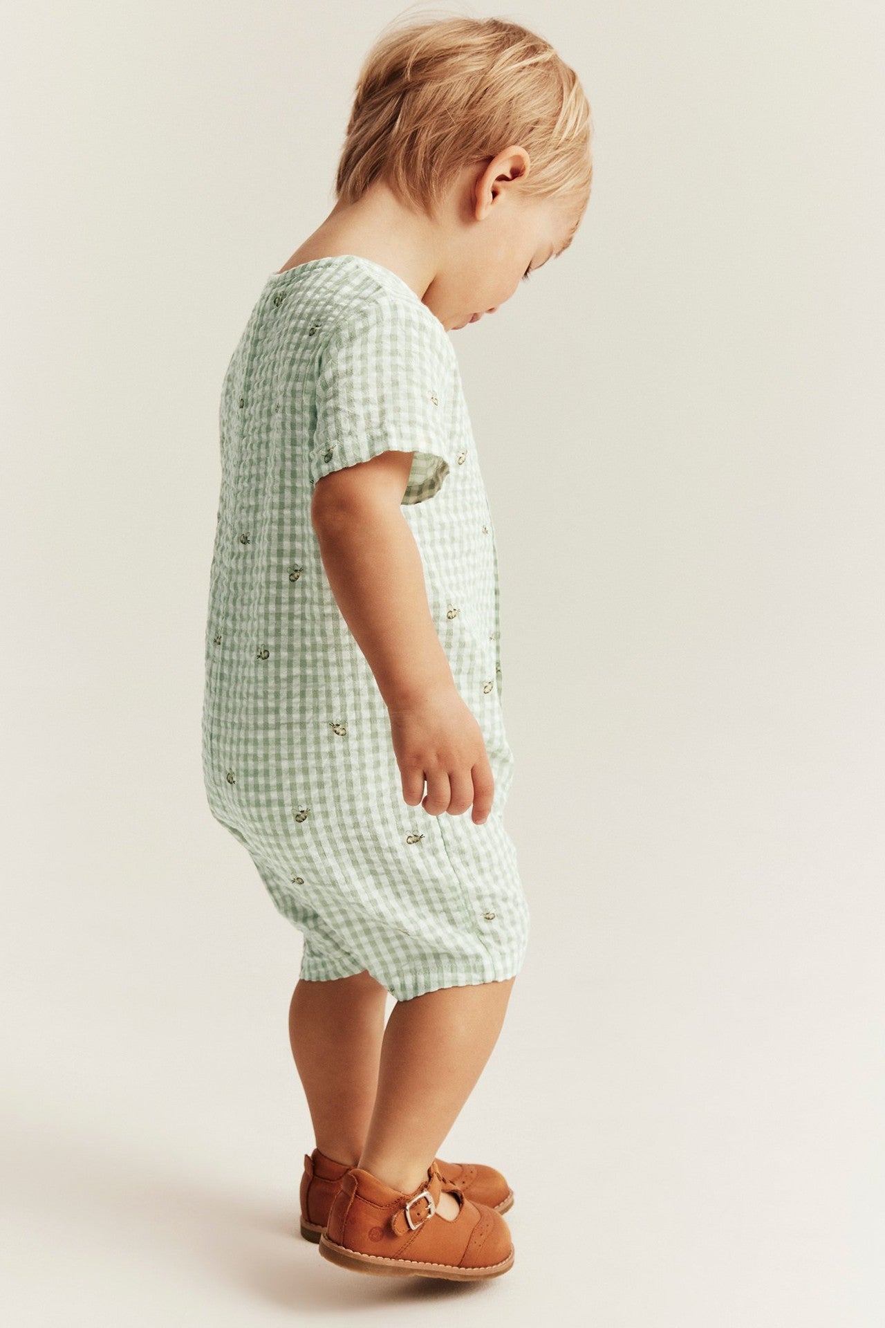 Baby checked romper with bee motif