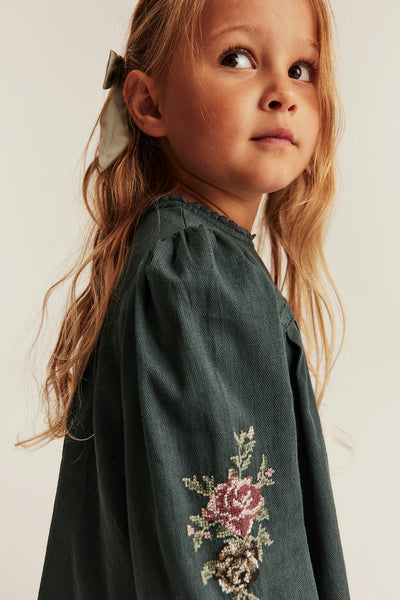 Kids green dress with cross-stitch embroidery