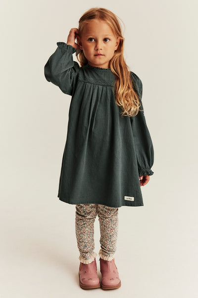 Kids green dress with cross-stitch embroidery