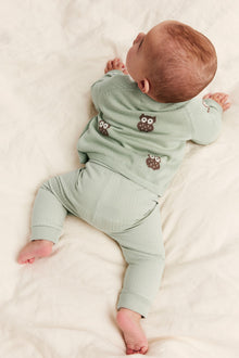 Baby green knitted cardigan with owls