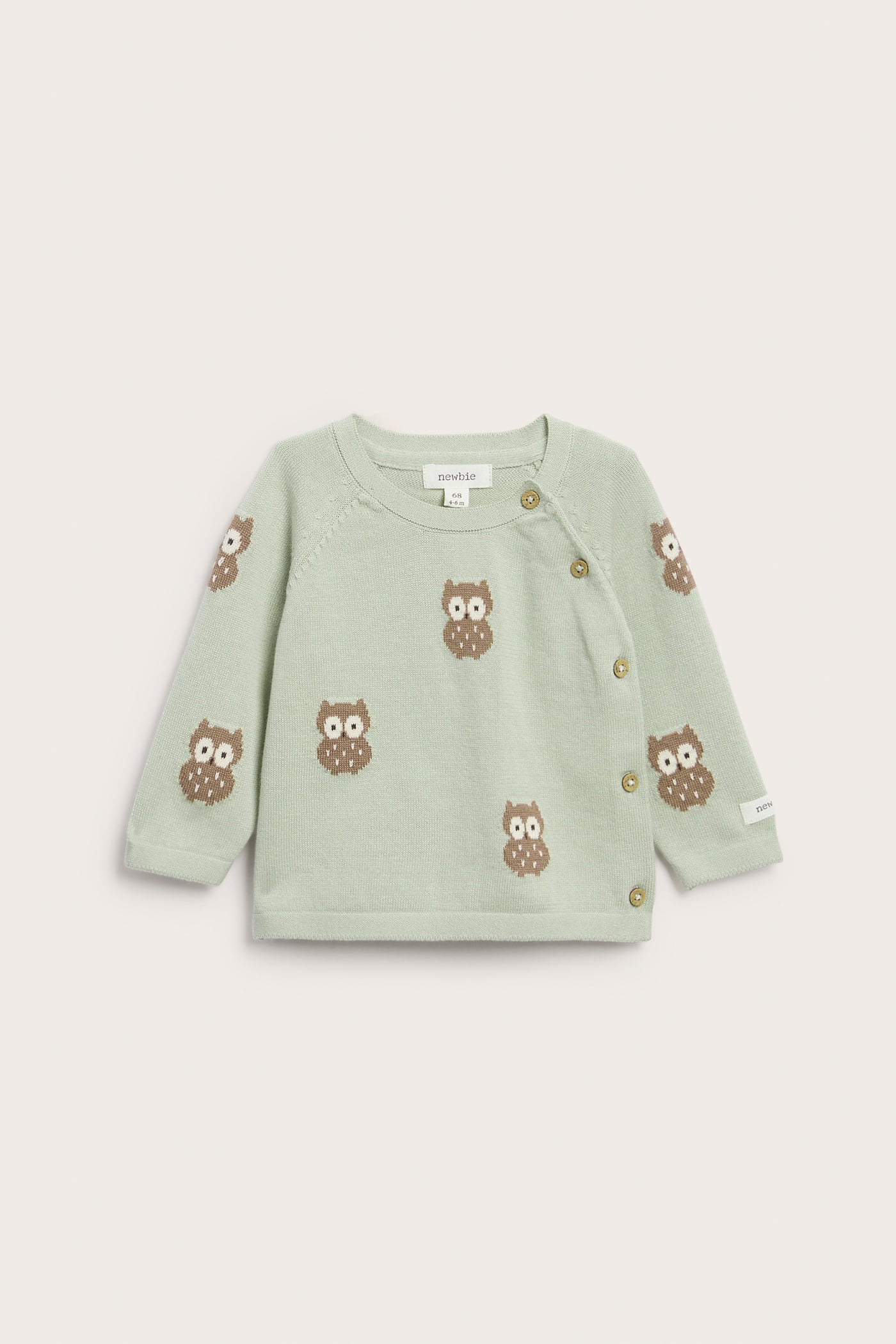 Baby green knitted cardigan with owls