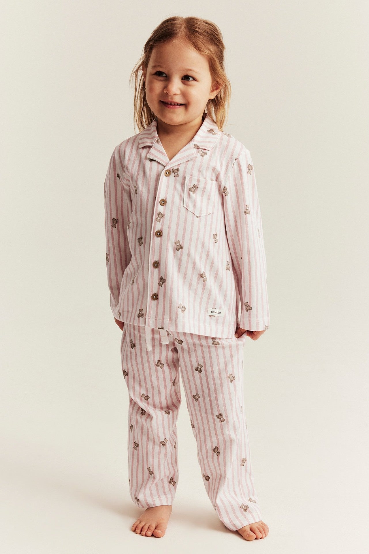Kids striped pajamas with teddy bear motif
