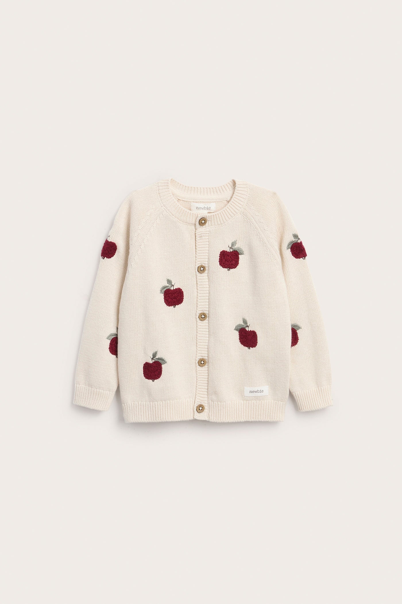 Baby beige knitted cardigan with apple