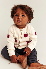 Baby beige knitted cardigan with apple