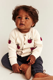 Baby beige knitted cardigan with apple