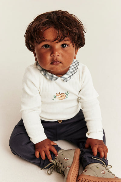 Baby bodysuit with checked collar