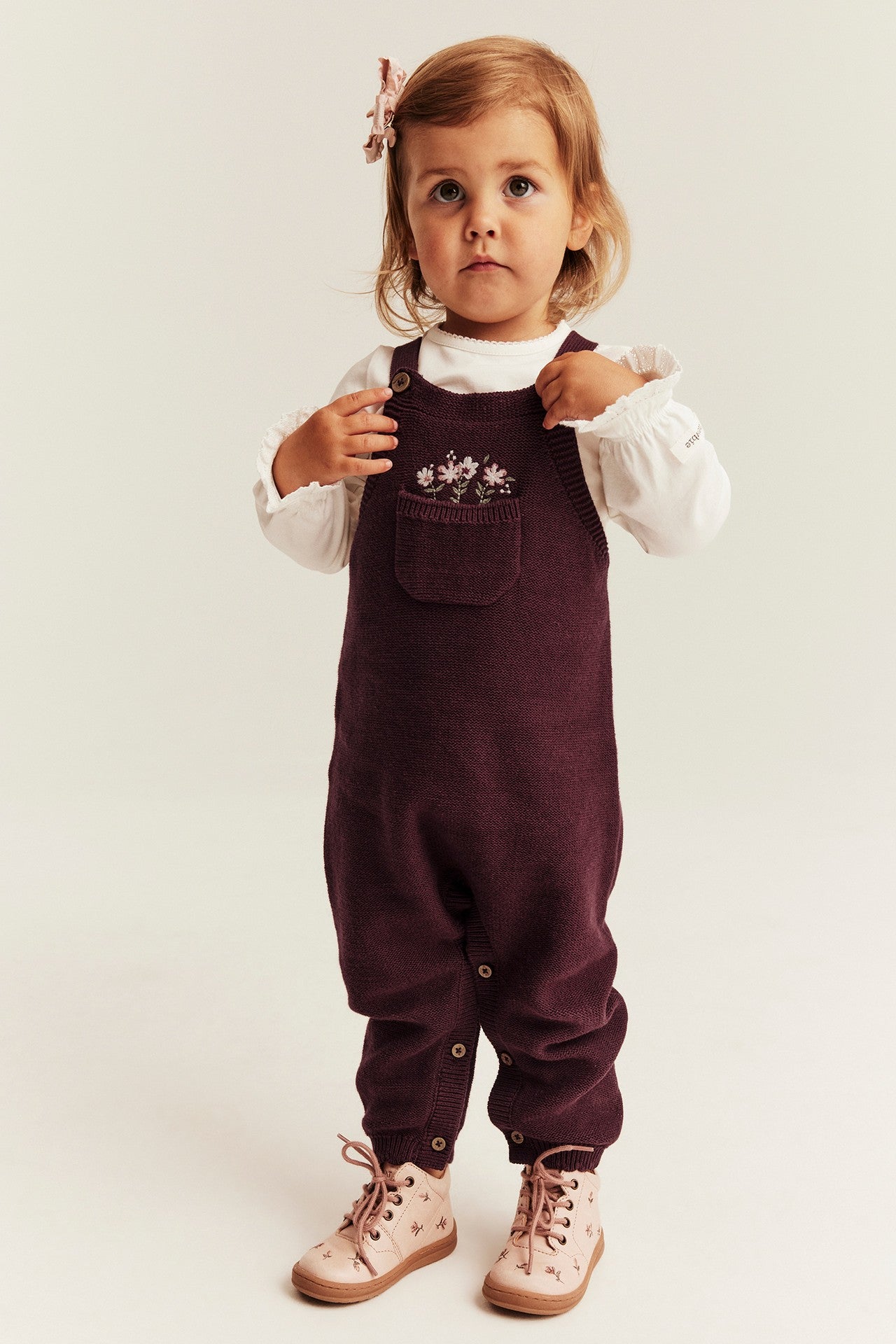 Baby knitted dungarees with embroidery