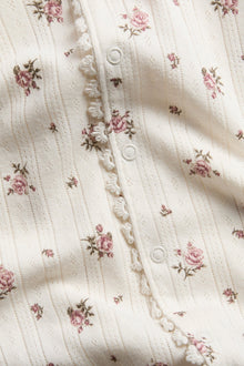 Baby pyjamas with rose pattern