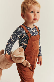 Baby blue bodysuit with all-over pattern