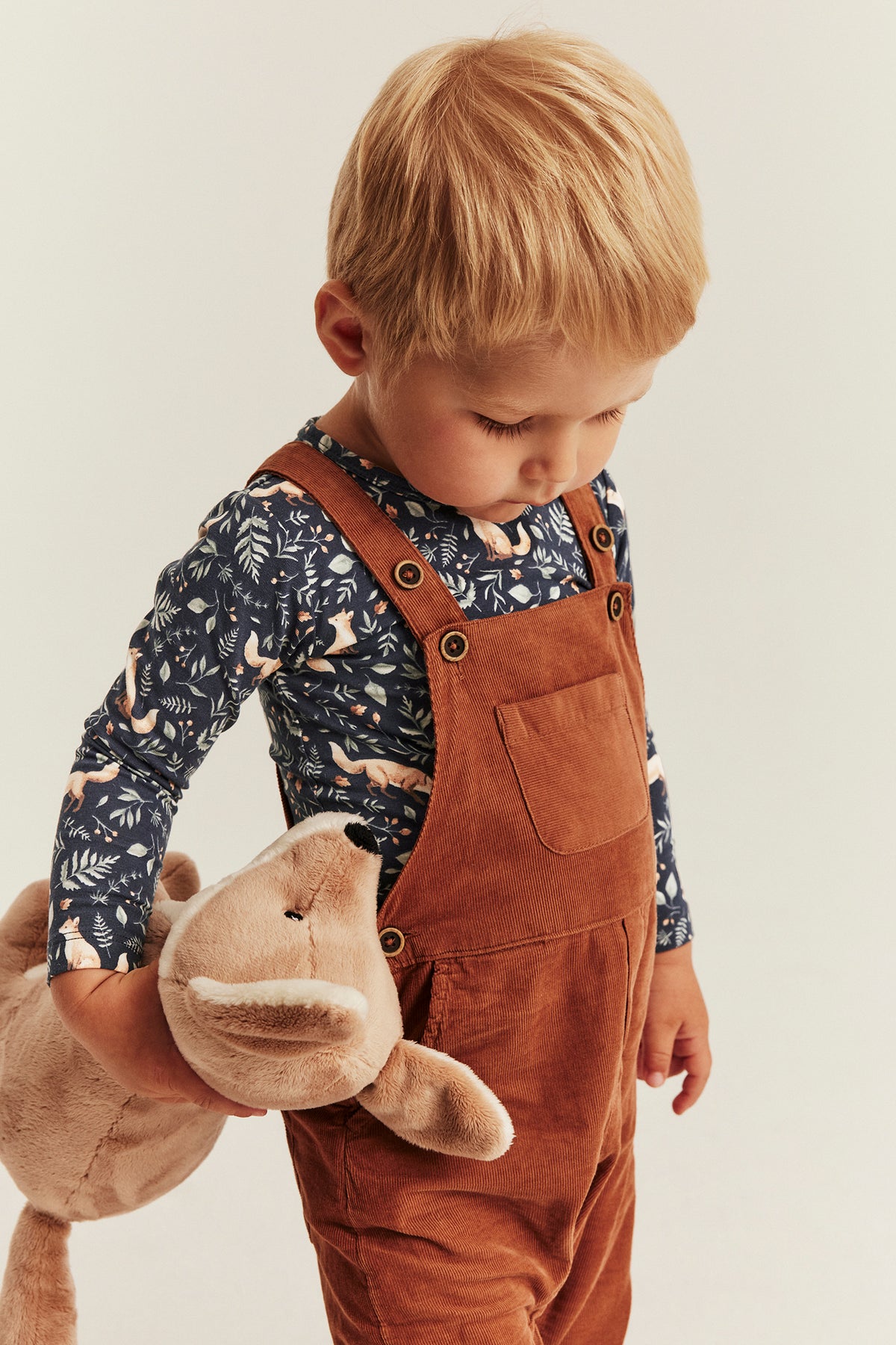 Baby blue bodysuit with all-over pattern