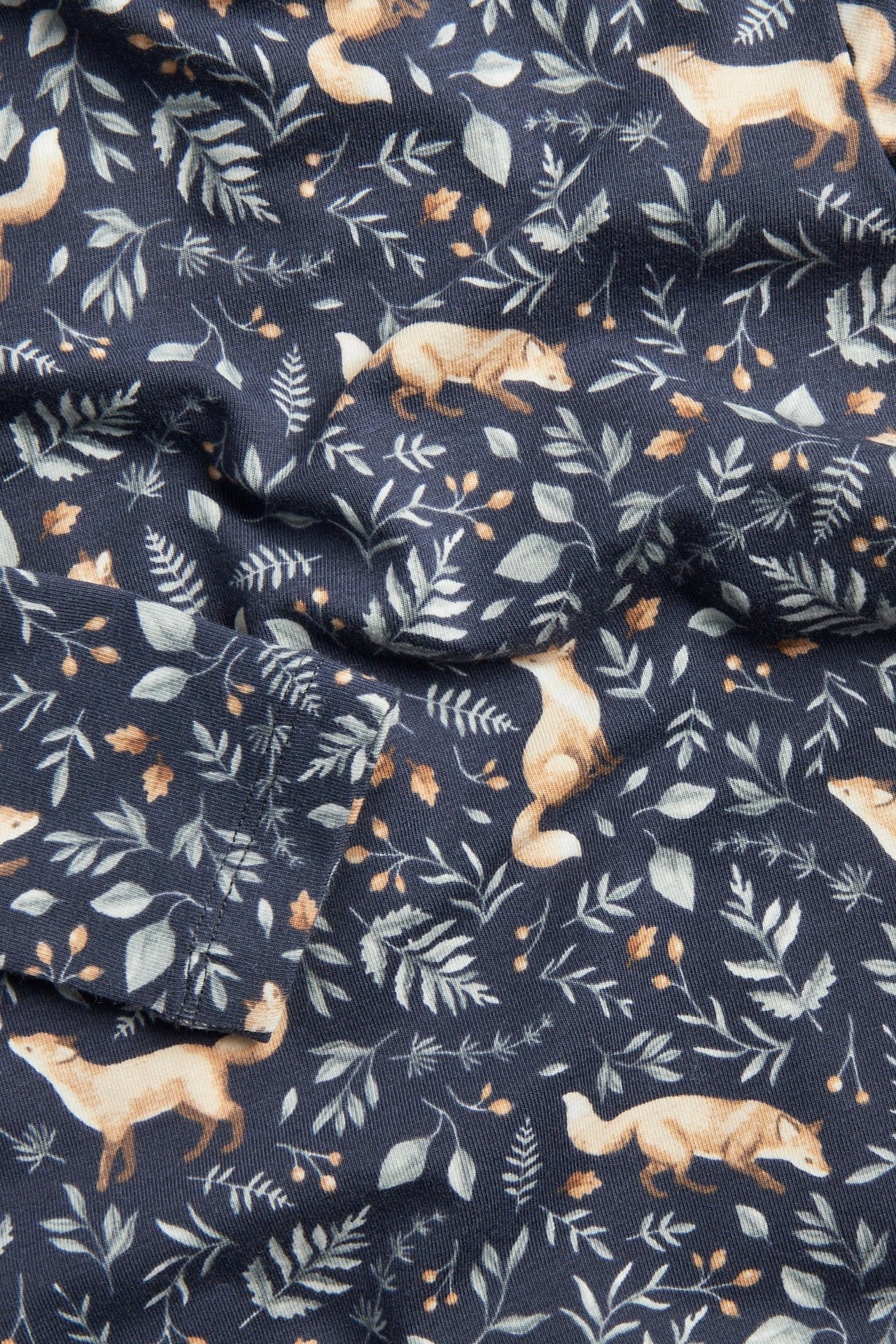 Baby blue bodysuit with all-over pattern