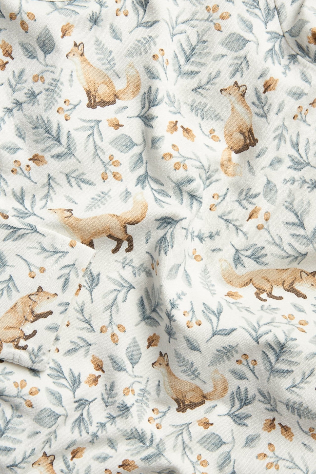 Baby white bodysuit with all-over pattern