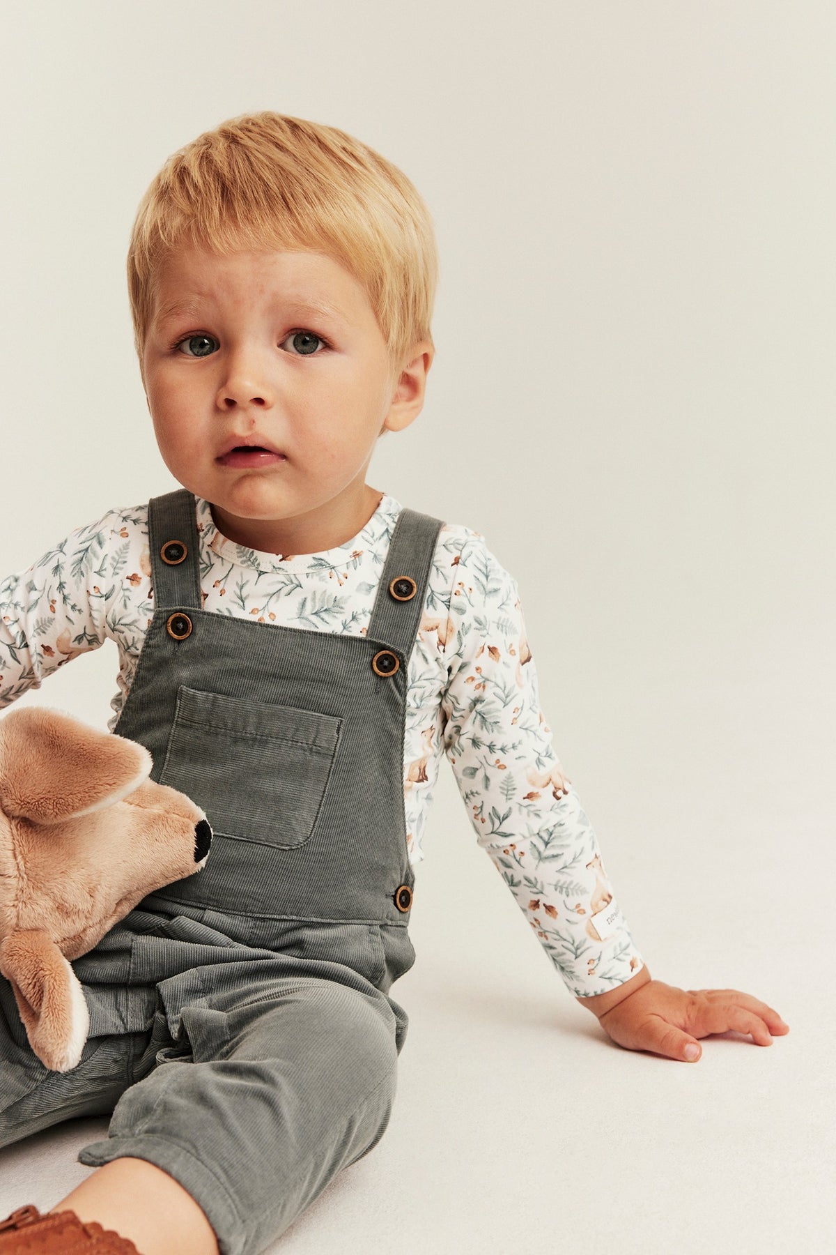 Baby white bodysuit with all-over pattern