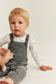 Baby white bodysuit with all-over pattern