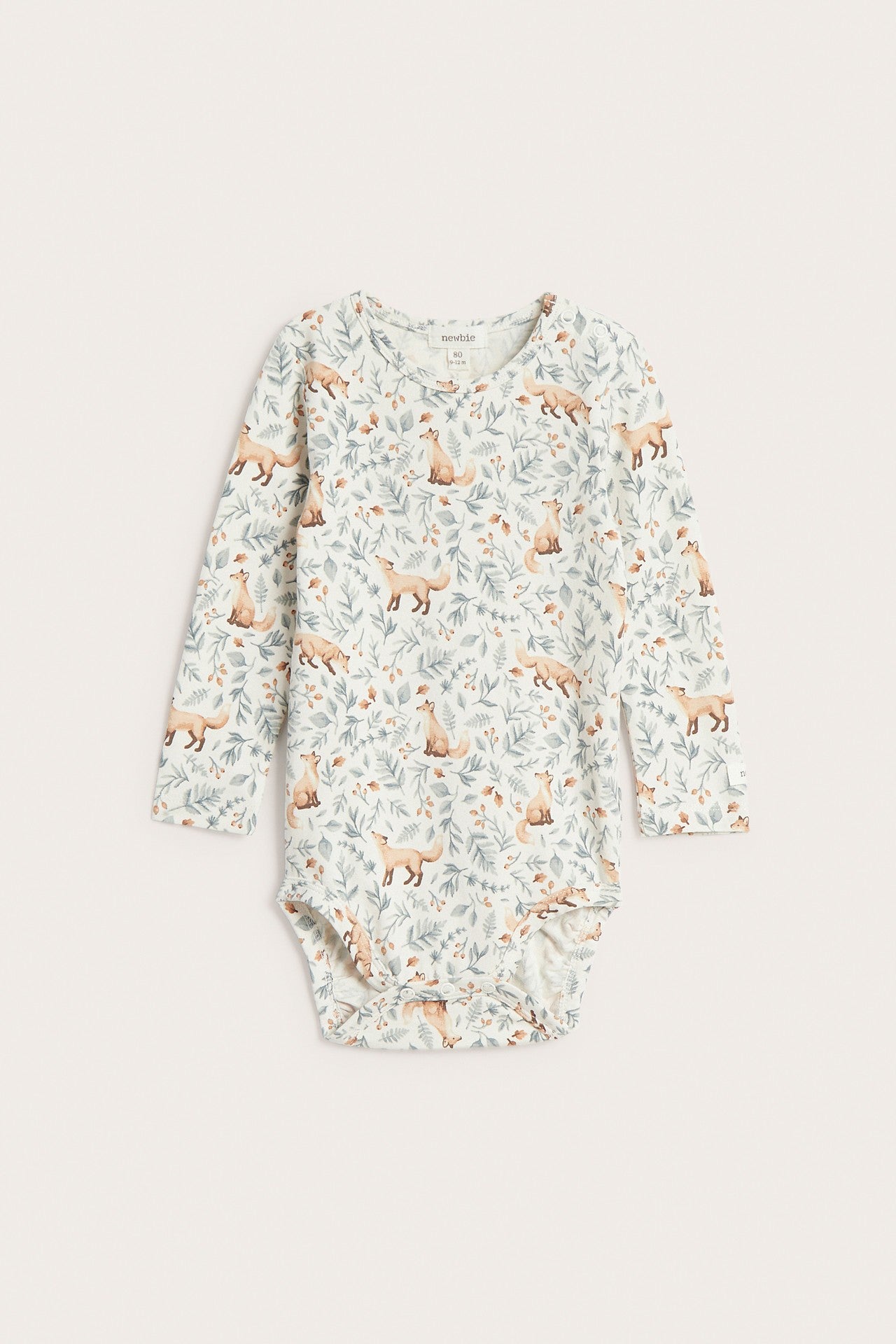 Baby white bodysuit with all-over pattern