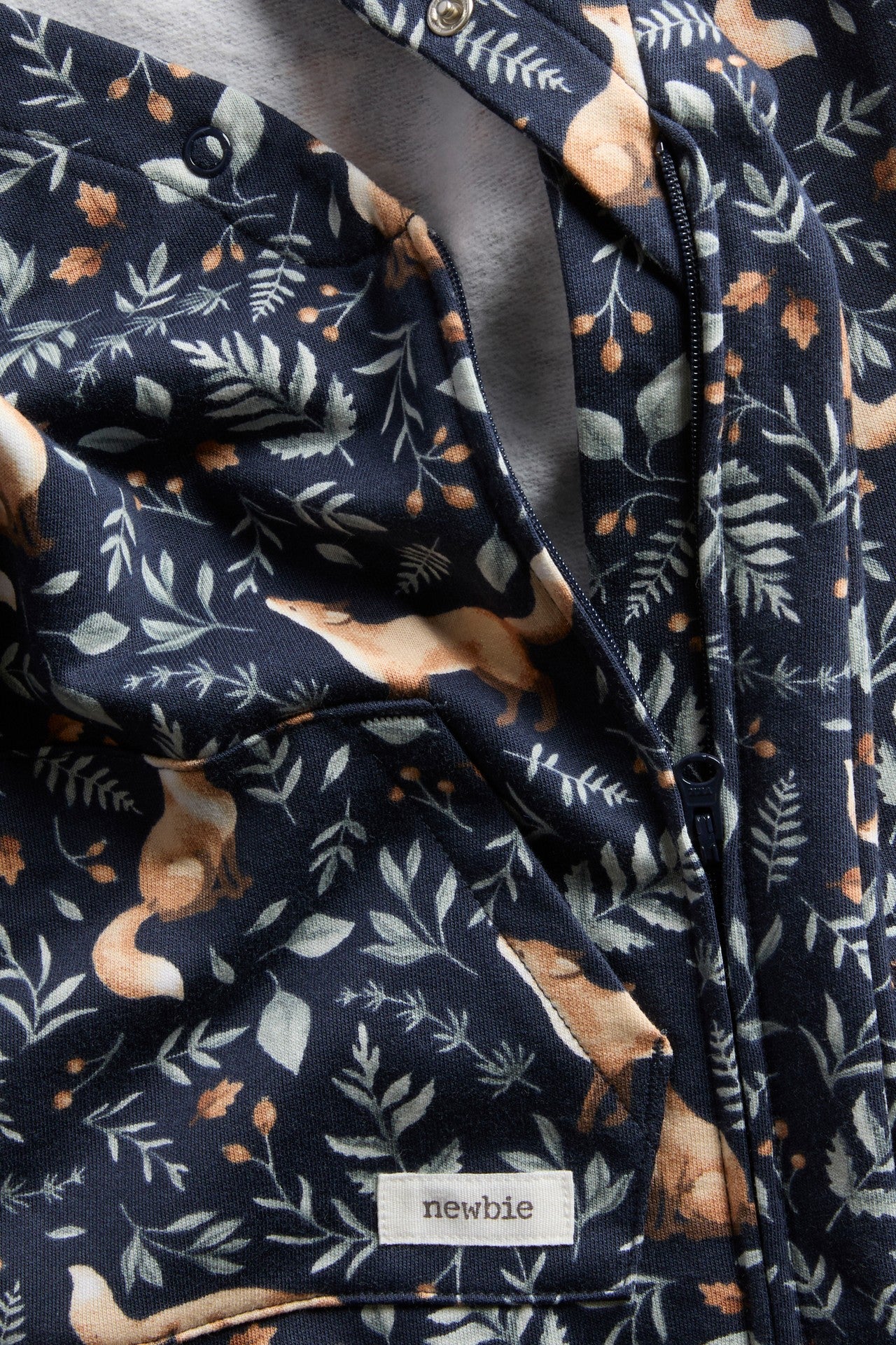 Baby blue jumpsuit with all-over fox pattern