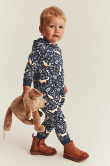 Baby blue jumpsuit with all-over fox pattern