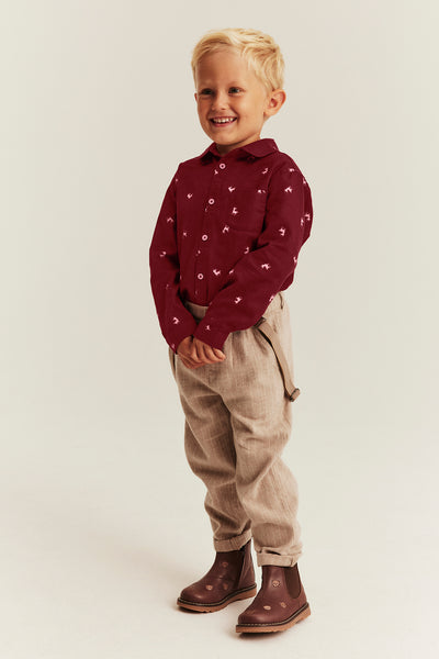 Kids red shirt with reindeer pattern