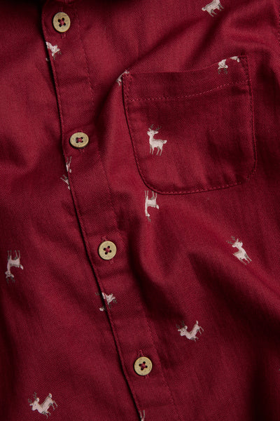 Kids red shirt with reindeer pattern