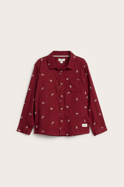 Kids red shirt with reindeer pattern